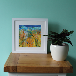 Framed artwork in situ yellow and blue Irish landscape with mountains