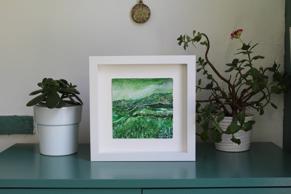 Framed green Irish landscape painting in situ by Iish artist Martina Furlong
